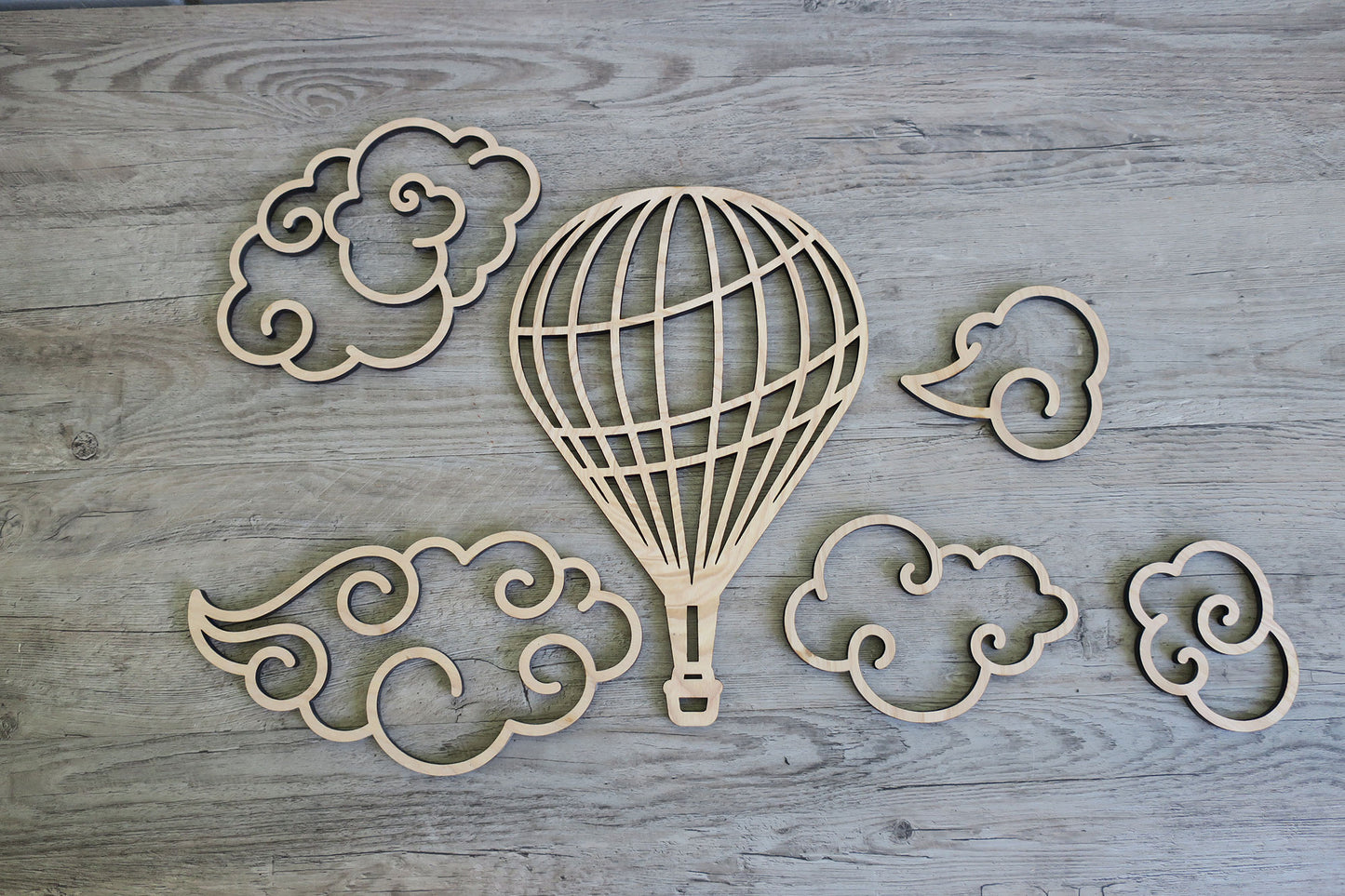 Wood balloon with clouds wall decor